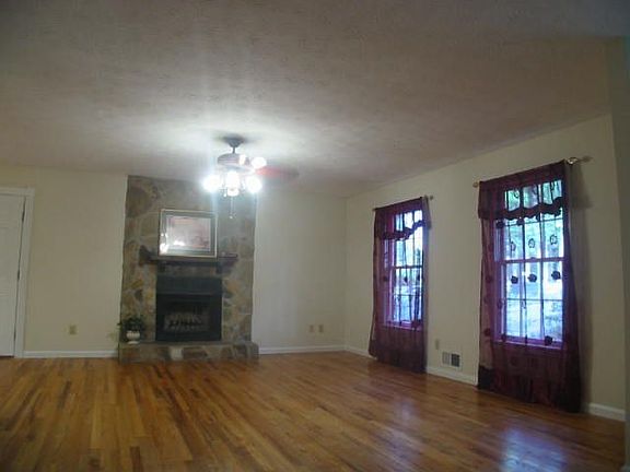 Spacious family room with cozy flagstone fireplace