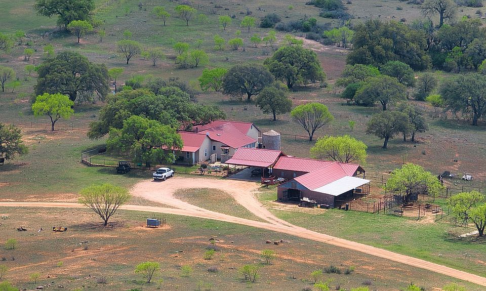 House with carport and barn