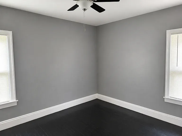 Bedroom with Ceiling Fan and Hardwood Floors