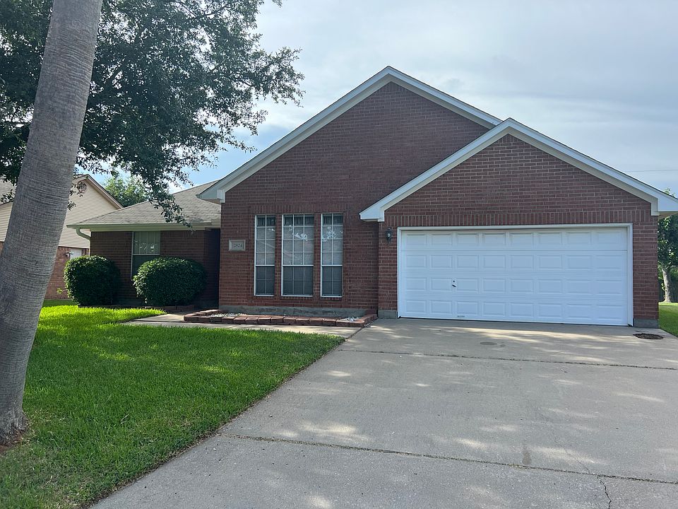 Beautifully, well maintained brick home with 2 car garage