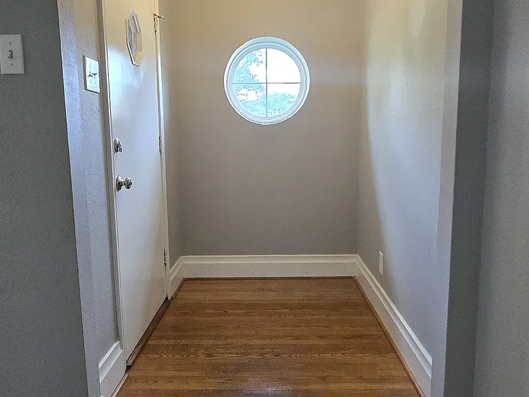 I love this round window beside the front door! My grandmother's house had one like it. :)