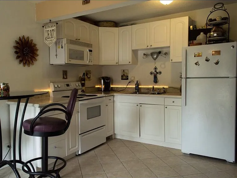 Combo kitchen, eating area, living area