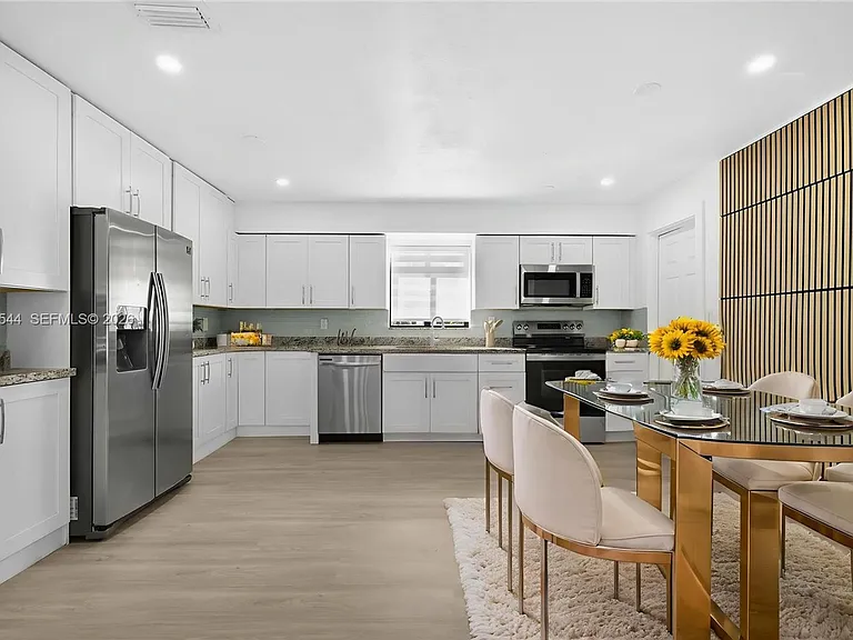 7501 Raleigh St — Photo 2