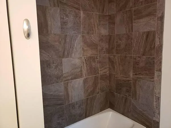 Tiled shower in master bathroom