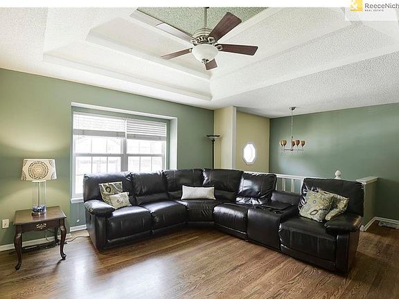 Enjoy the coffered ceiling with fan in the Living Room.