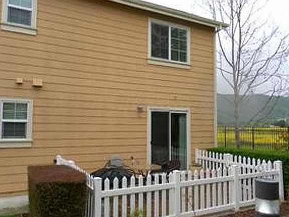 Backyard gated patio accessible from bedroom or garage.  