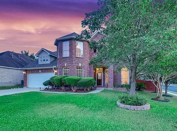 Lovely mature trees in well maintained and landscaped front yard.