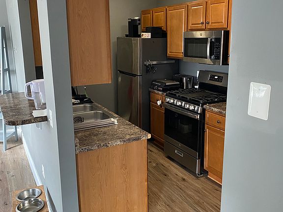 Kitchen, gas stove, open into living room