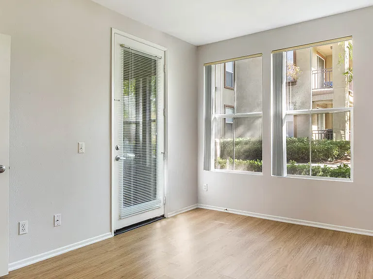 Bedroom with Balcony and Hard Surface Flooring