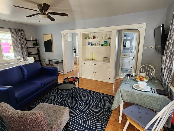 The living room built-in gives the space character. The unit is unfurnished, but this is one of many possible ways to arrange furniture in this cozy upstairs space.