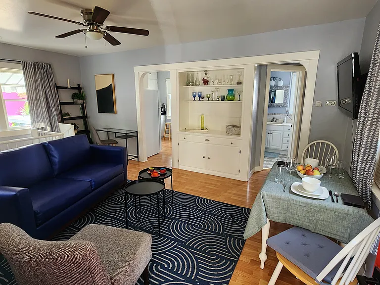 The living room built-in gives the space character. The unit is unfurnished, but this is one of many possible ways to arrange furniture in this sweet upstairs space.