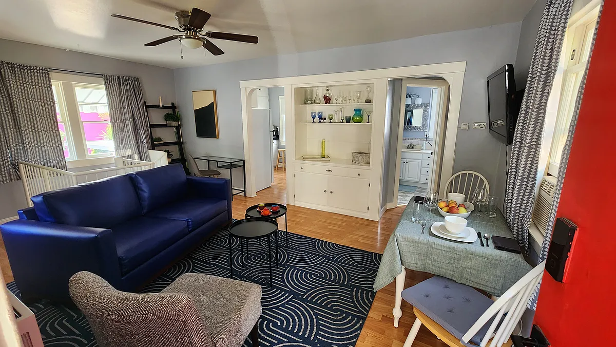 The living room built-in gives the space character. The unit is unfurnished, but this is one of many possible ways to arrange furniture in this cozy upstairs space. - Healdsburg Ave