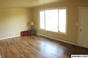Front Room with beautiful refinished hardwood floors and fresh paint