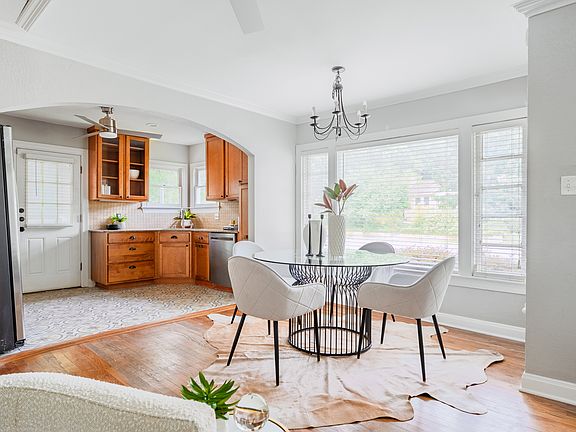Dining to kitchen. Door in background to side entry from driveway.