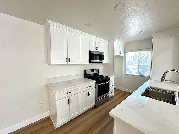 Brand new kitchen with large stainless steel sink
