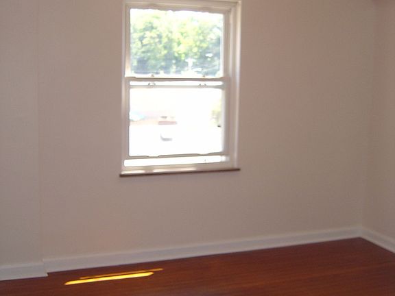 Bedroom three on level two with refinished floor