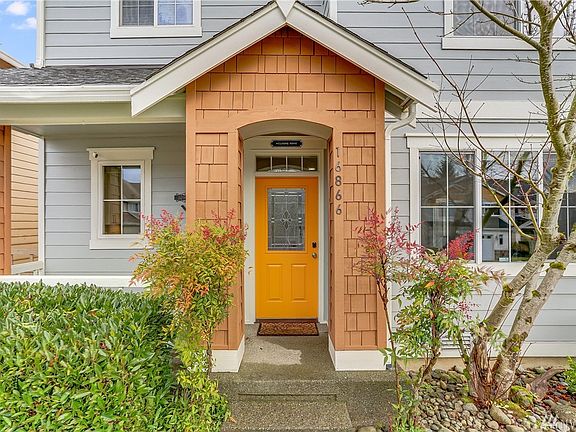 Front door with a quaint front porch. 
