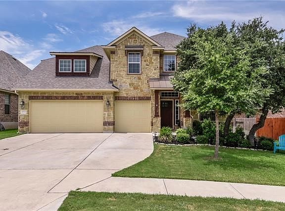 3-car garage with plenty of parking space.