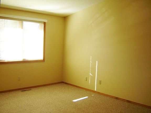 Spacious master has new carpet and a private bath and walk in closet.