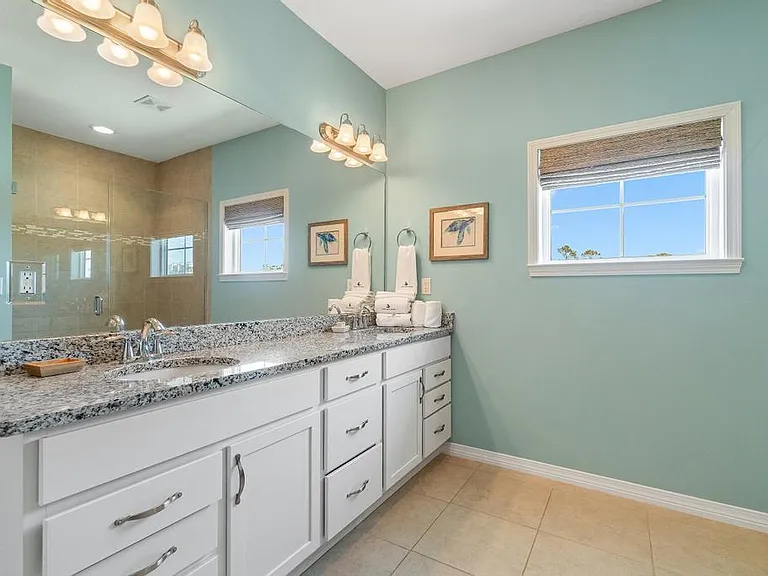 Primary bathroom with double vanities (stand up shower only).