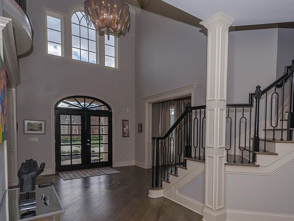 Entry has all new refinished hardwood floors, with new hardwood to match installed in the study and family room, new bannister spindles, new lighting in entry