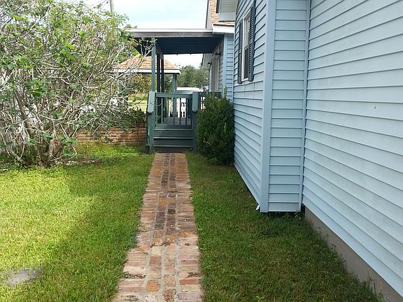 Brick walkway to back