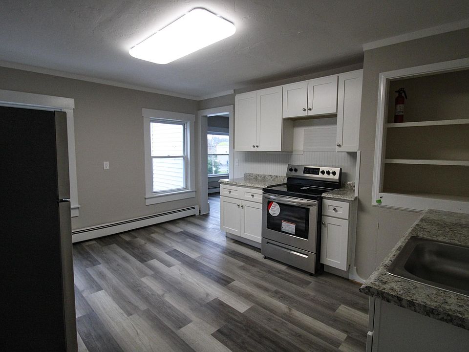 Kitchen with new stainless-steel appliances, new countertops, new floor, and new cabinets!