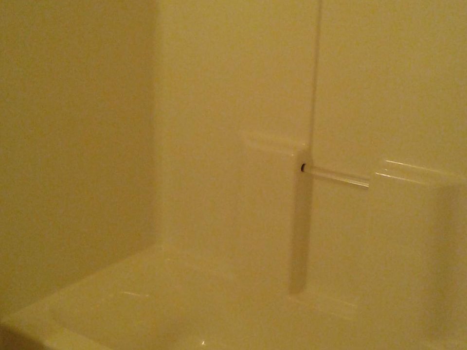Hall bath with acrylic tub surround