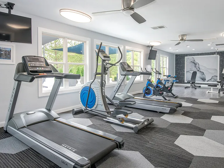 Stay fit in our well-equipped fitness center featuring treadmills, exercise bikes, and complete workout equipment, professionally operated by Highlands Vista Group.
