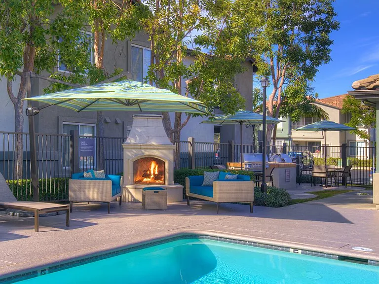 Swimming pool with lounge seating and fireplace