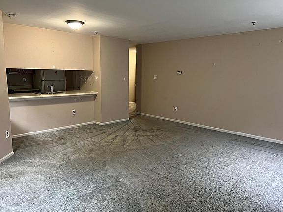 living room with view of condition kitchen