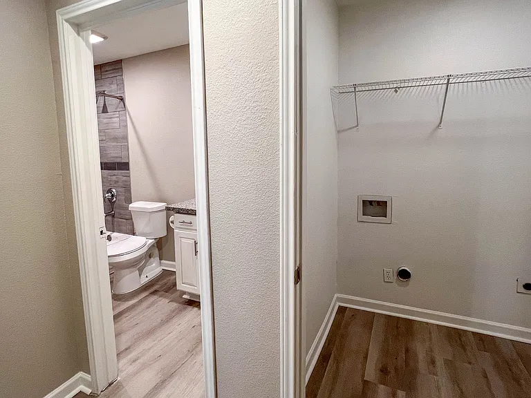 Dedicated laundry area located in the hallway next to the second full bath.