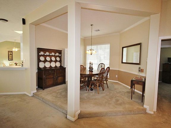 This formal dining room is sure to please with graceful columns and elevated status.