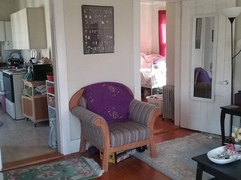 view from livingroom into kitchen and bedroom