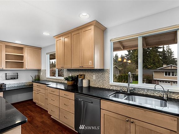 Notice the built-in office nook, or homework corner for kids while you cook