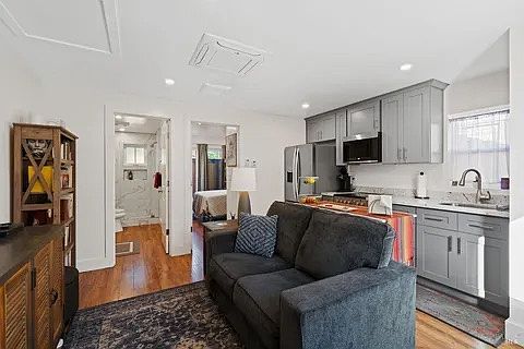 Comfortable sitting room and kitchen with modern kitchen. (furniture not included)