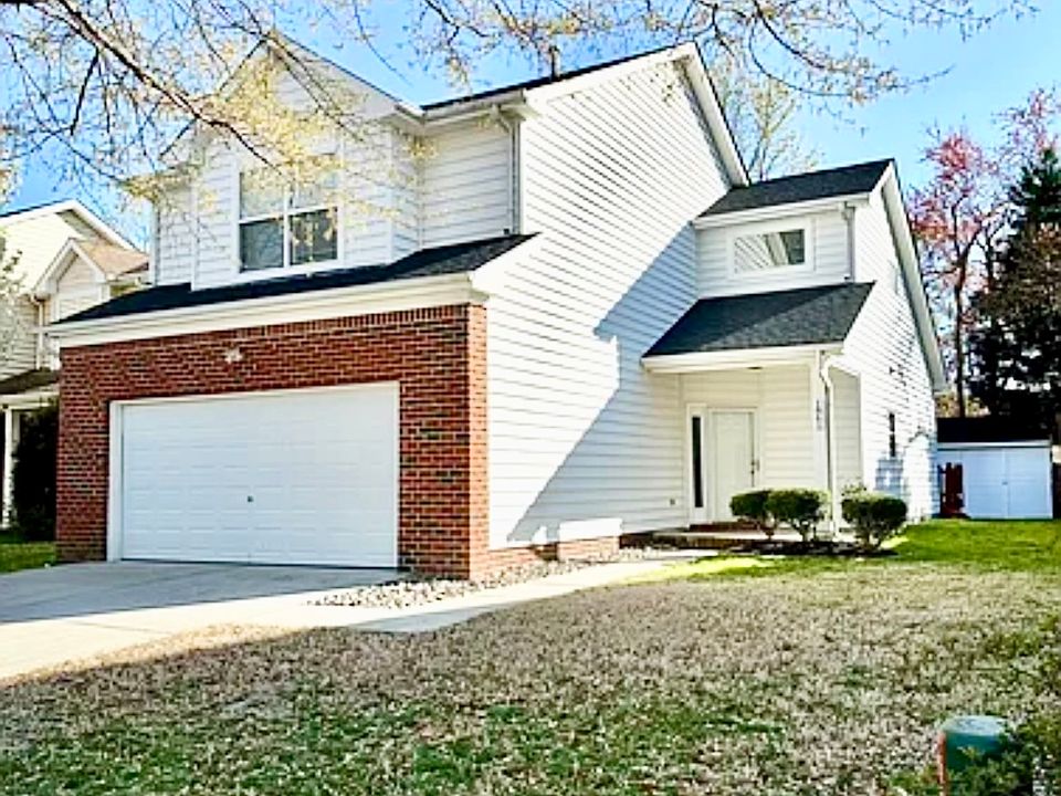 Front of the house with two car garage and off street parking