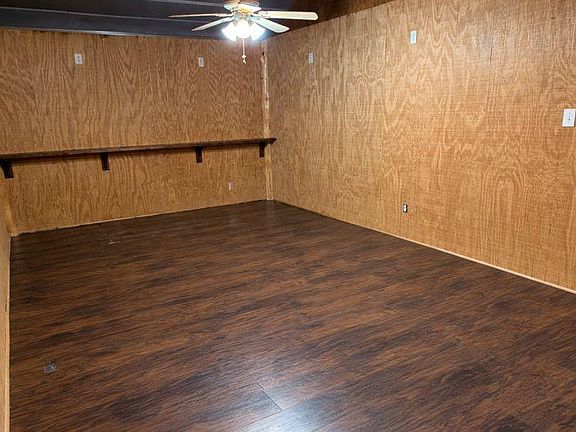 Man cave, tv, barstools, mini fridge and futon chair will be added