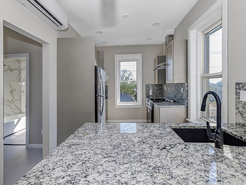 Kitchen with view of bathroom.