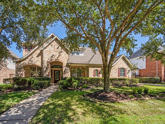 Beautiful stone front elevation with a large front porch, located on a cu-de-sac street with nice established landscaping & shade trees to welcome you as you approach the home.