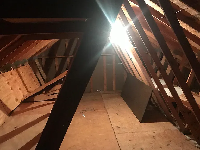 walk-in attic for extra storage ( Attic accessed via walk-in stairs)