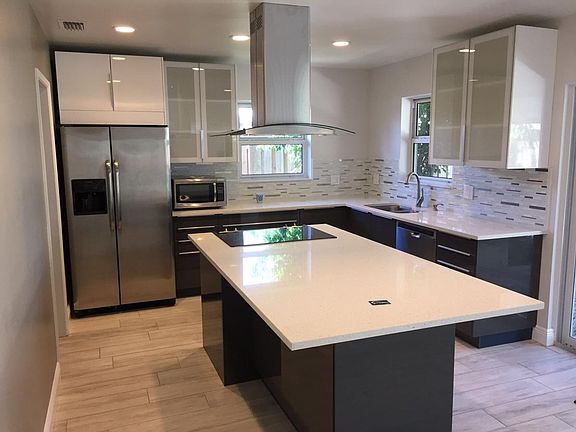 Kitchen with Quartz island and range