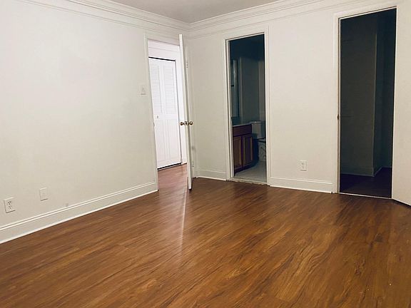 Master bedroom with bathroom and walk-in closet