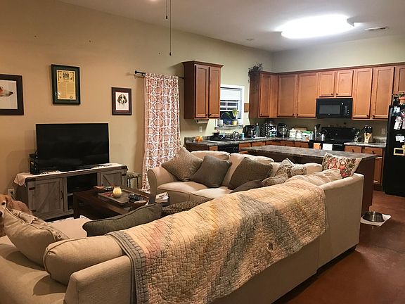 Once you enter through the front door, you can appreciate the open-concept floor plan with a seamless transition from the living room, kitchen, and dining area.