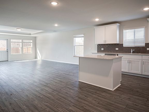 Open-concept throughout main living areas.