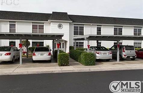 One dedicated covered parking space plus guest parking.