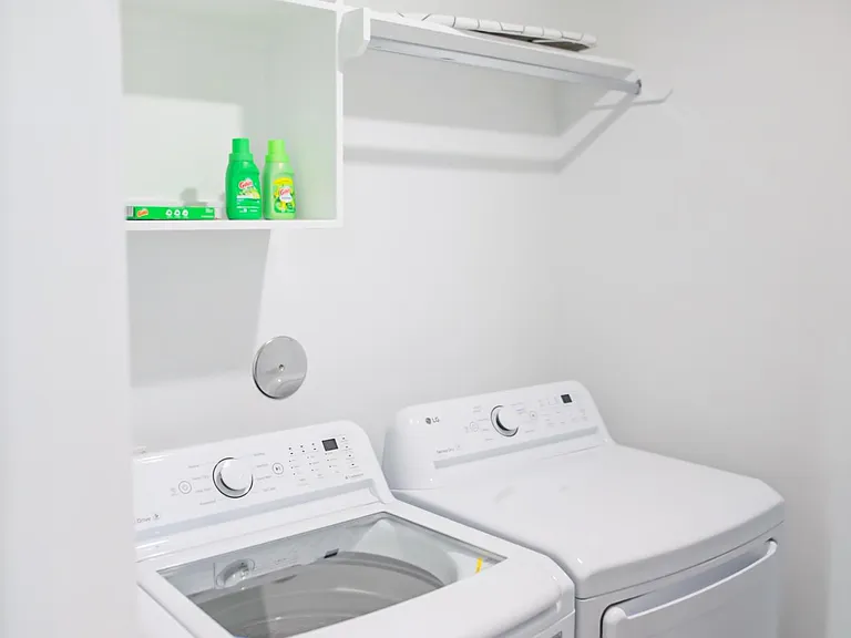 Laundry room next to kitchen.