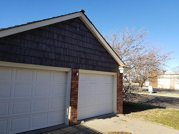 2 car garage with storage room