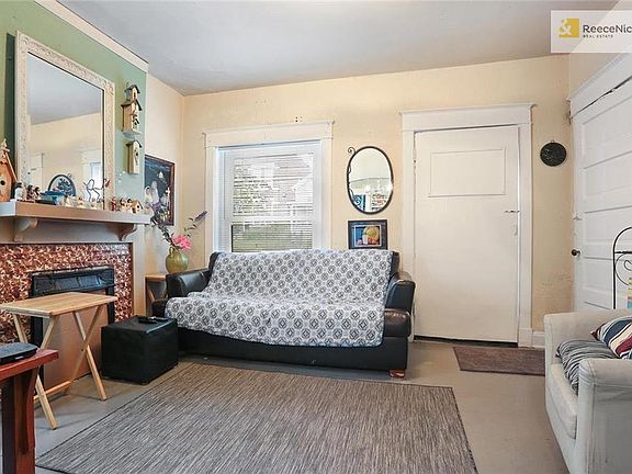 Center stair case has private entries to each unit. On 1st floor both units have been combined into one living space, but still maintain separate entrances.
