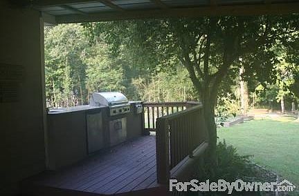 Large deck with out door kitchen.
						:
						36" gas grill, 2 burner cooktop, sink, refridgerator all stainless on granite .